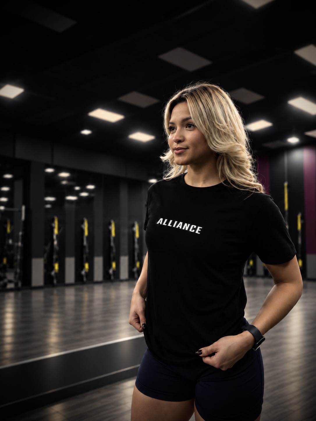 Bella Saenz wearing the black ALLIANCE Every Day Tee with white chest lettering